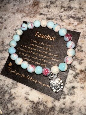 Beaded Teacher Appreciation Bracelet in a Light Blue Marble with Apple Charm